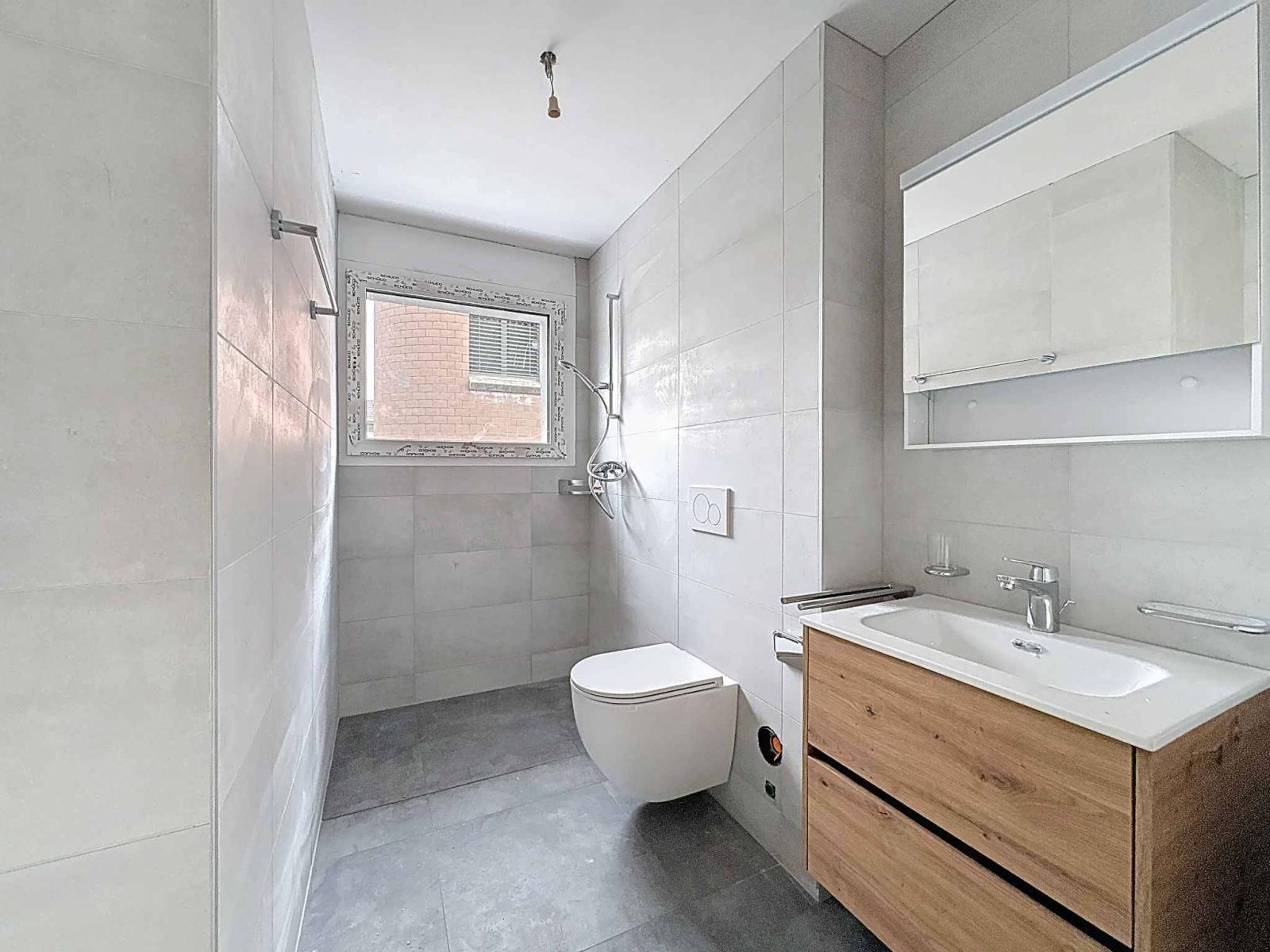 Appartement de 3.5 pièces neuf au rez-de-chaussée avec terrasse