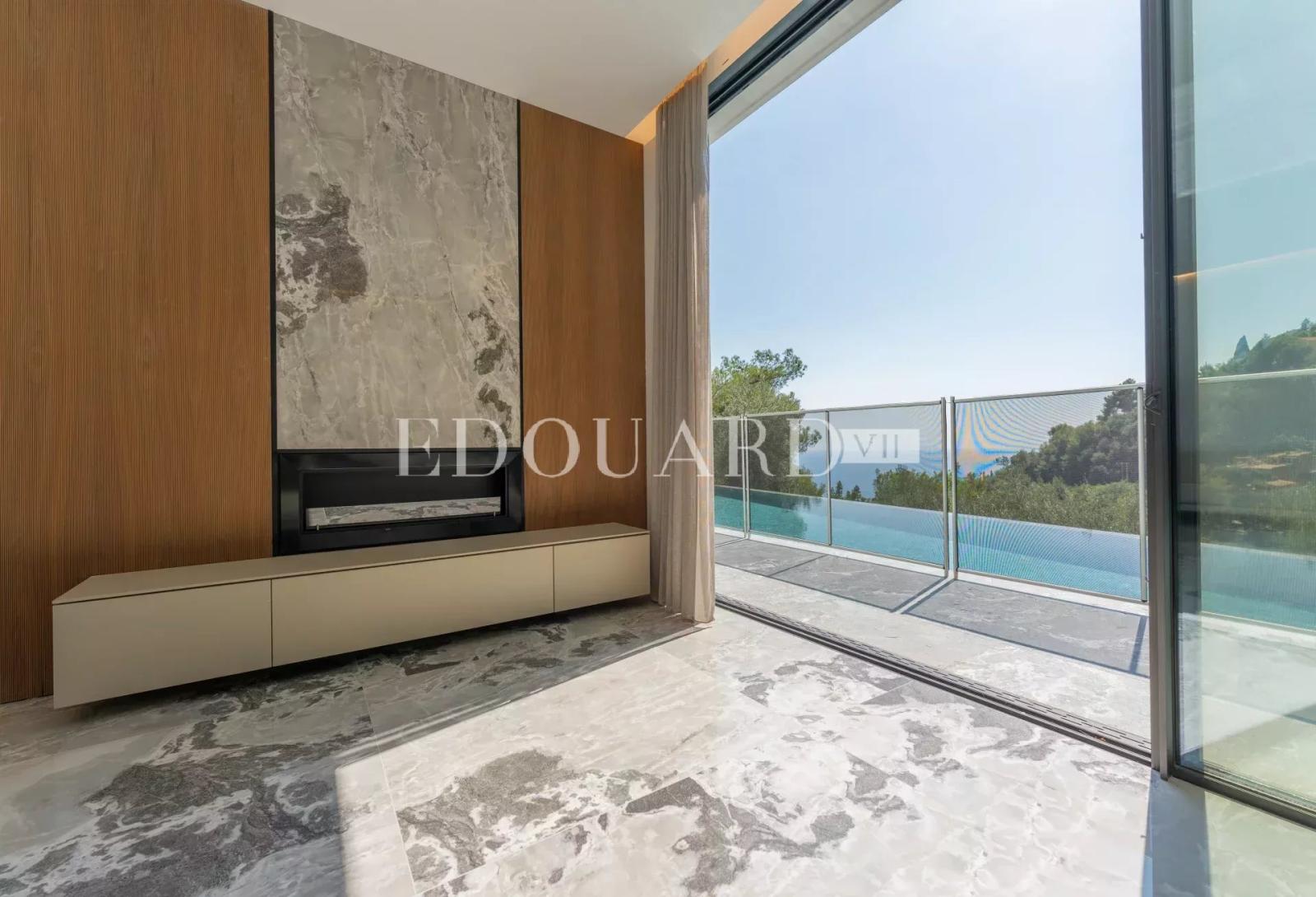 En exclusivité villa neuve avec domotique, ascenseur, grandes terrasses, piscine à débordement et belle vue mer