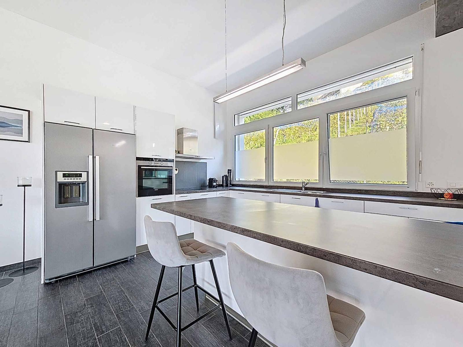 Maison contiguë de 5.5 pièces avec jardin et vignes