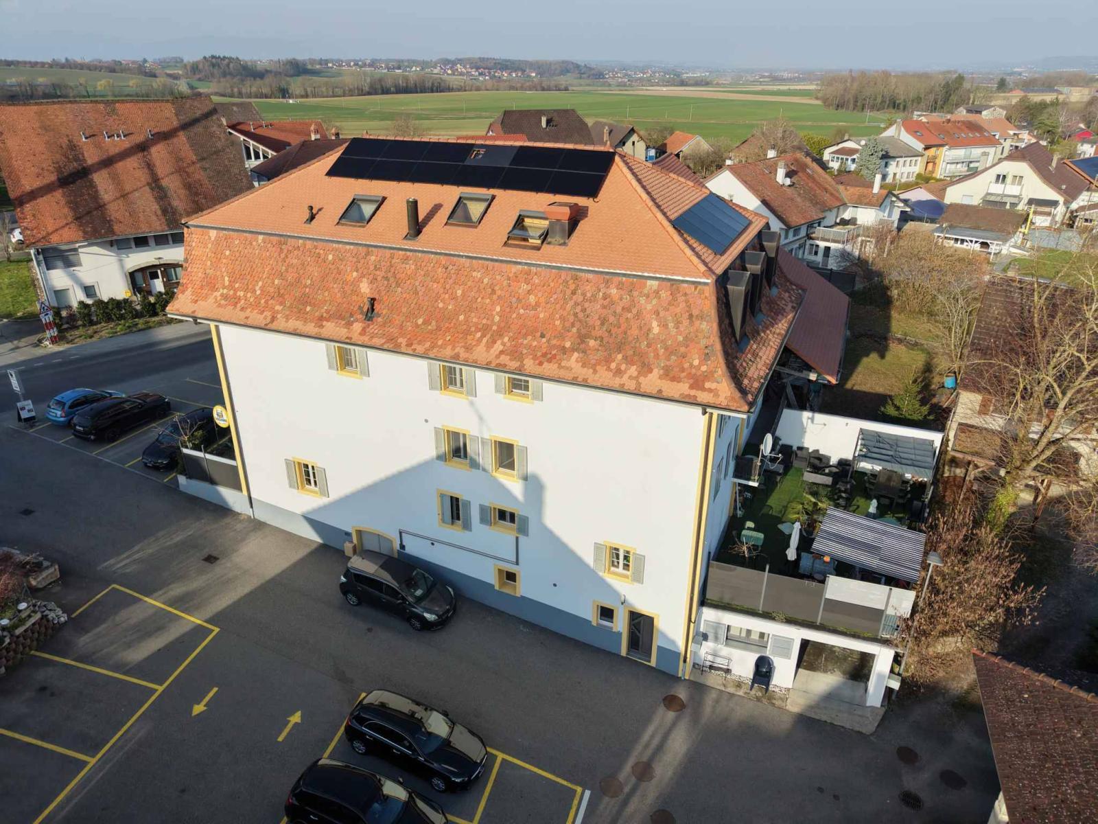Immeuble d’habitation avec café-restaurant au coeur de la Broye